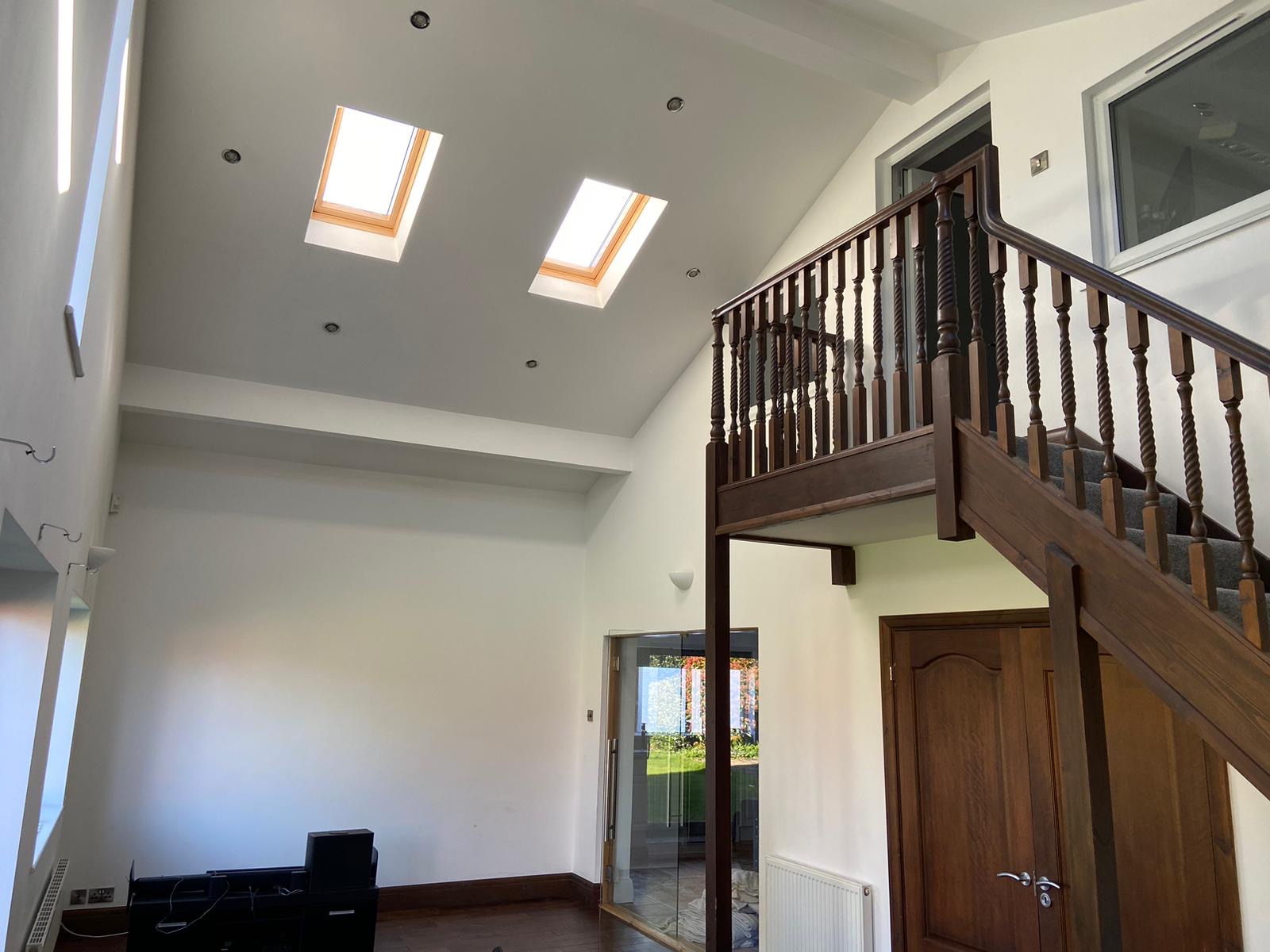 Finished high-ceiling interior after painting and decorating