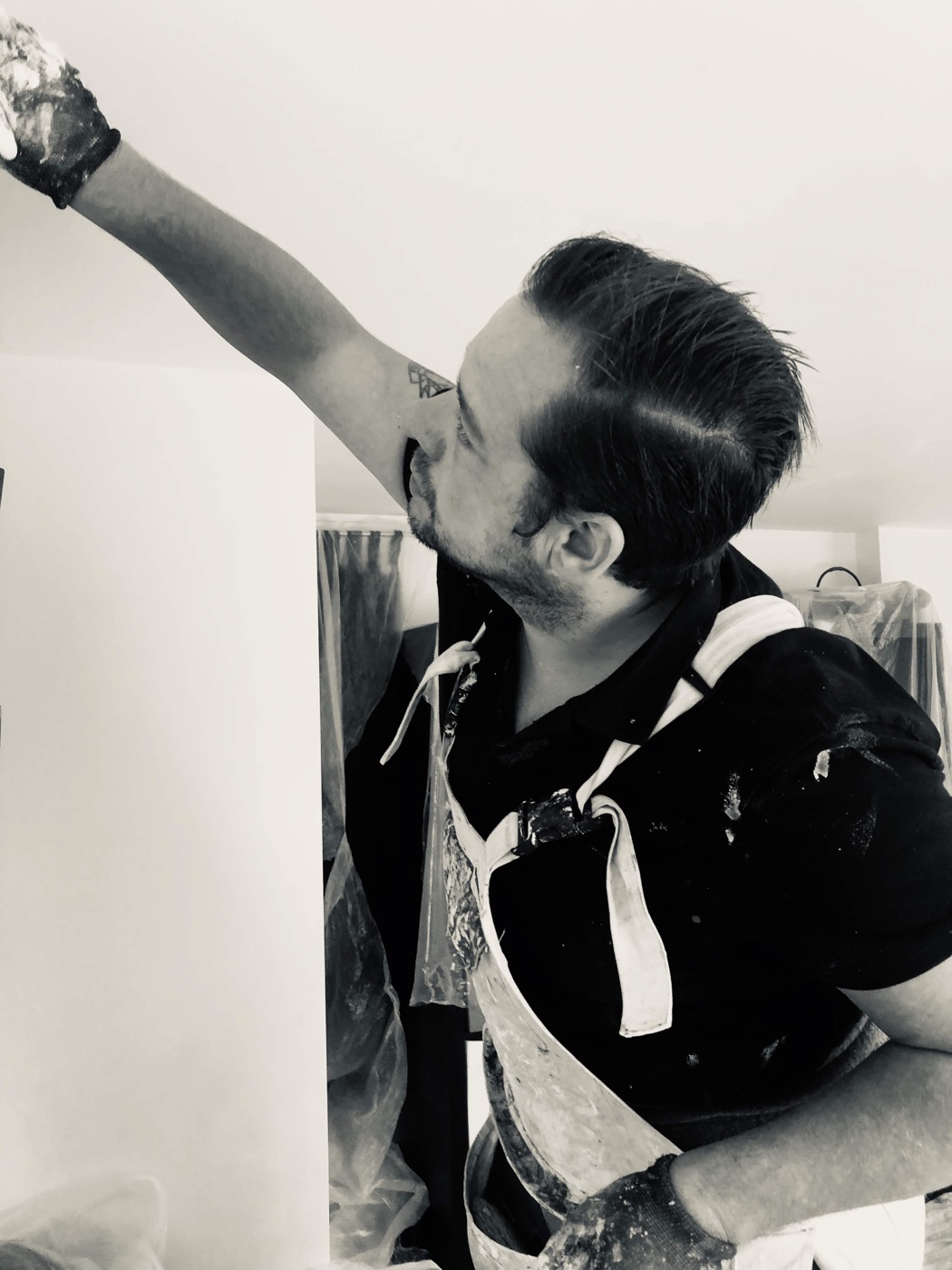 Nottingham painter and decorator working carefully on an interior wall
